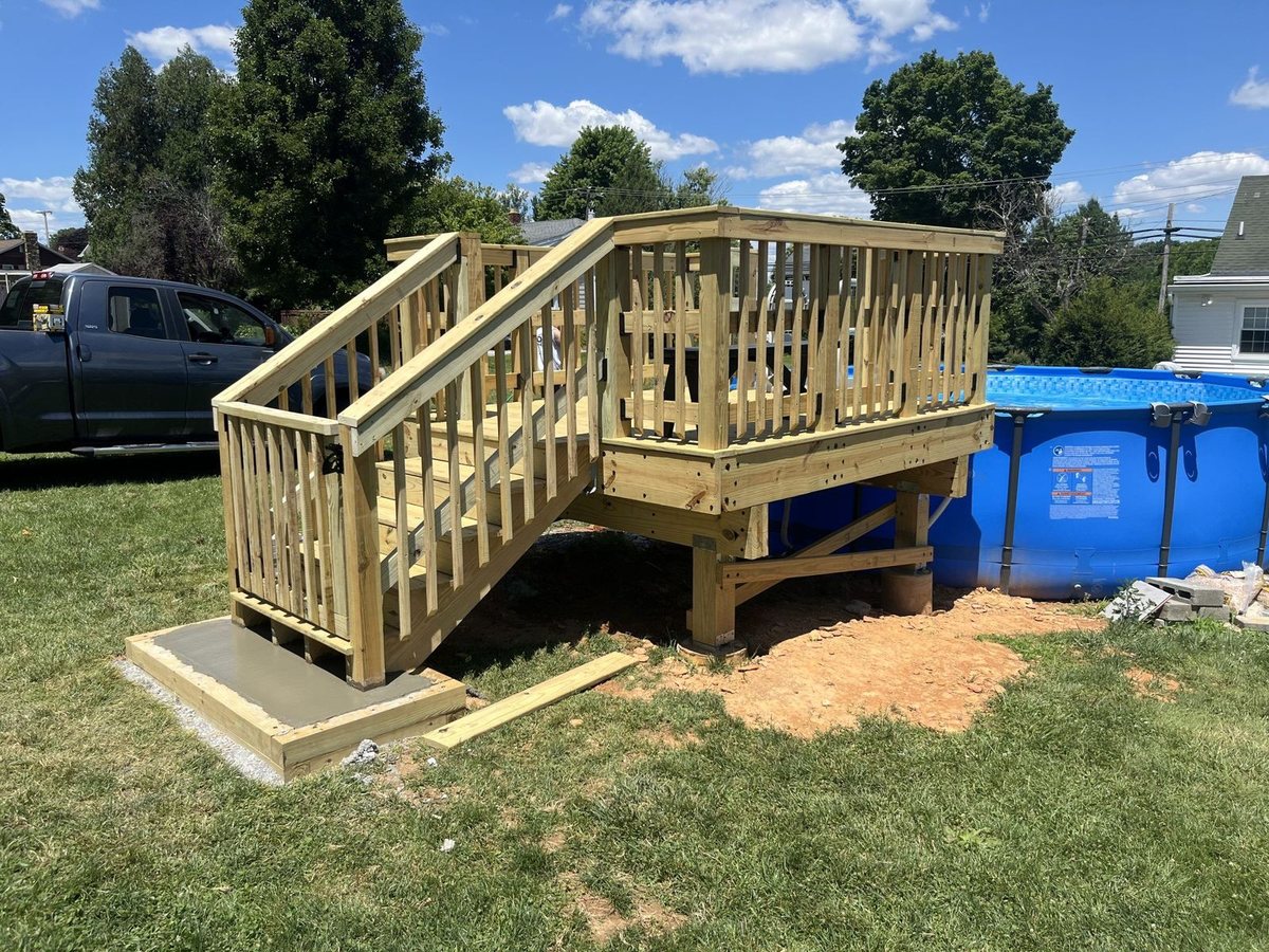 New wood deck under construction in a backyard