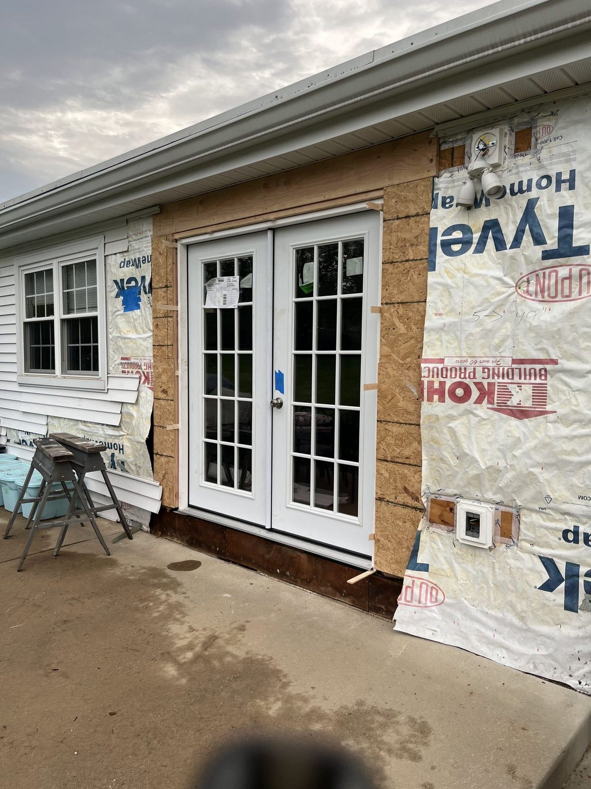 New exterior door and siding installation in progress